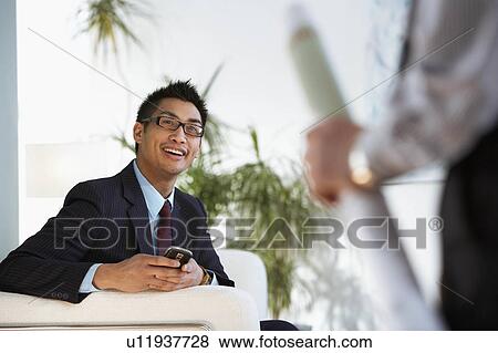 Business colleagues meet in al lobby View Large Photo Image Stock Photo - Business colleagues meet in al lobby. Fotosearch