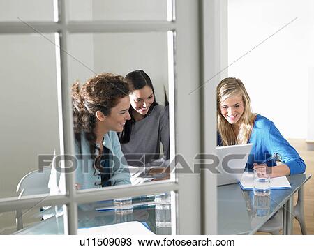 Business women working, smiling View Large Photo Image Stock Image - Business women working, smiling. Fotosearch