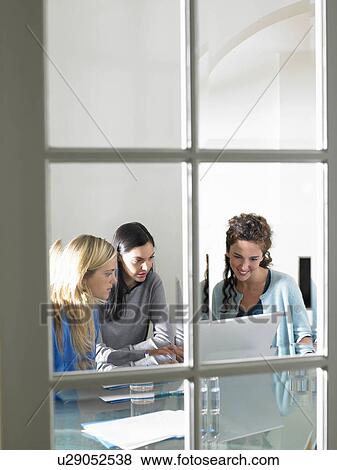 Business women working, smiling View Large Photo Image Stock Photo - Business women working, smiling. Fotosearch