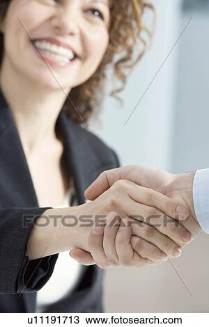 Businesswoman smiles and shakes hands View Large Photo Image Stock Image - Businesswoman smiles and shakes hands. Fotosearch
