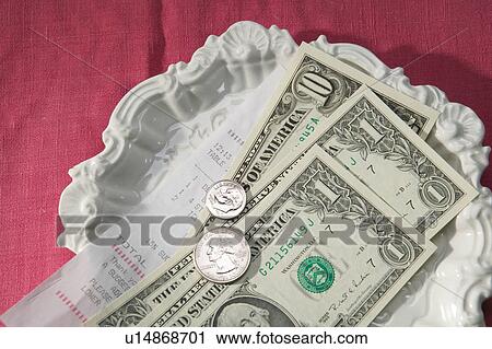 Stock Image - Change from a cafe restaurant bill. Fotosearch