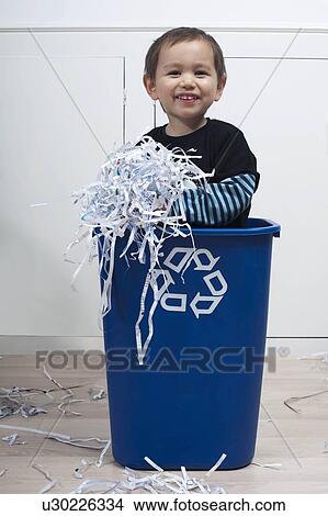Picture - child in recycling bin. Fotosearch