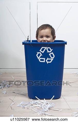 Stock Photo - child in recycling bin. Fotosearch