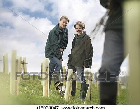 Stock Photo - Children Planting Trees. Fotosearch