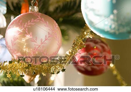 Christmas decorations on tree View Large Photo Image Picture - Christmas decorations on tree. Fotosearch