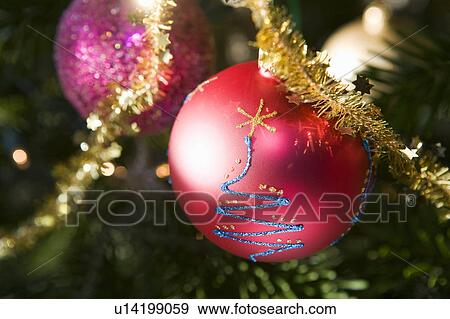 Christmas decorations on tree View Large Photo Image Stock Photo - Christmas decorations on tree. Fotosearch