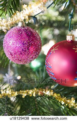 Christmas decorations on tree View Large Photo Image Stock Photo - Christmas decorations on tree. Fotosearch