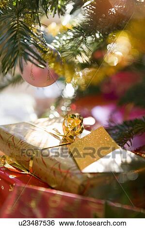 Christmas presents under tree View Large Photo Image Stock Photograph - Christmas presents under tree. Fotosearch