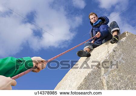 Climber belaying fellow climber View Large Photo Image Stock Photography - Climber belaying fellow climber. Fotosearch