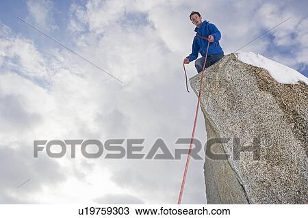 climber belaying on snow covered peak View Large Photo Image Stock Image - climber belaying on snow covered peak. Fotosearch