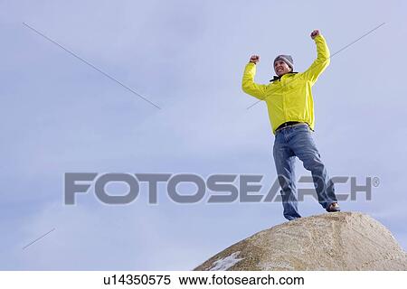 Climber celebrating on mountain peak View Large Photo Image Stock Photography - Climber celebrating on mountain peak. Fotosearch