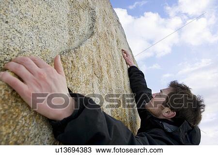 climber free climbing boulder View Large Photo Image Stock Image - climber free climbing boulder. Fotosearch