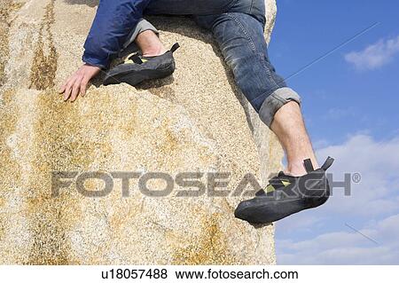Climber free climbing boulder View Large Photo Image Stock Photo - Climber free climbing boulder. Fotosearch