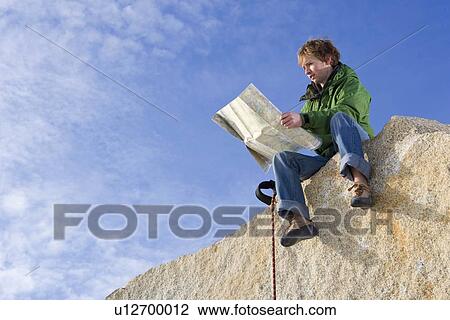 Climber looking at map View Large Photo Image Stock Image - Climber looking at map. Fotosearch