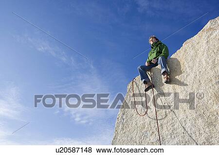 Climber sitting on peak View Large Photo Image Stock Photo - Climber sitting on peak. Fotosearch