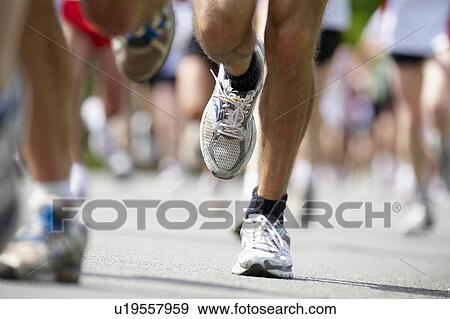 Stock Photo - Close up of running feet. Fotosearch