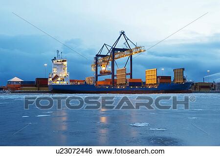 Stock Photograph - Containers on ship in harbour. Fotosearch