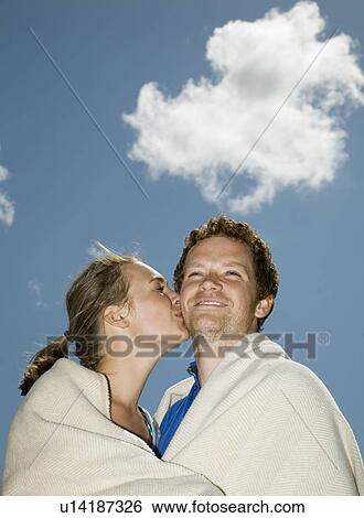 Couple in Blanket, Kissing View Large Photo Image Stock Photograph - Couple in Blanket, Kissing. Fotosearch
