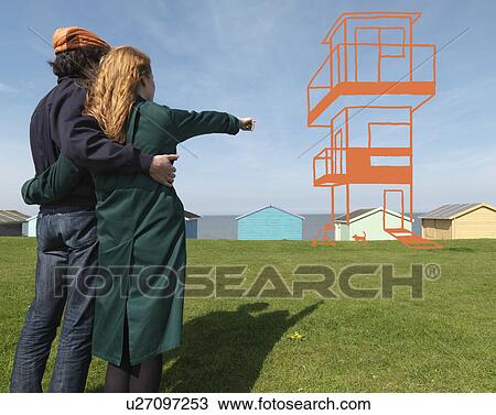 Couple looking at imaginary house View Large Photo Image Stock Image - Couple looking at imaginary house. Fotosearch