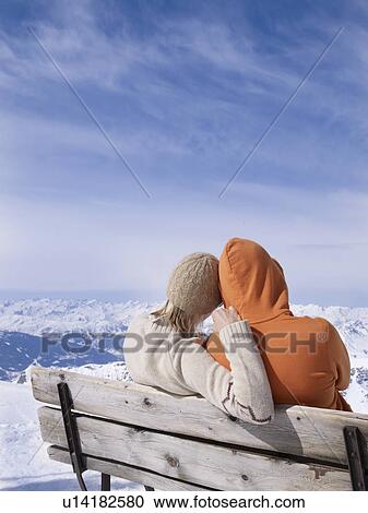 couple on bench hugging View Large Photo Image Stock Image - couple on bench hugging. Fotosearch