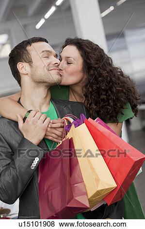 couple shopping and kissing View Large Photo Image Stock Photo - couple shopping and kissing. Fotosearch