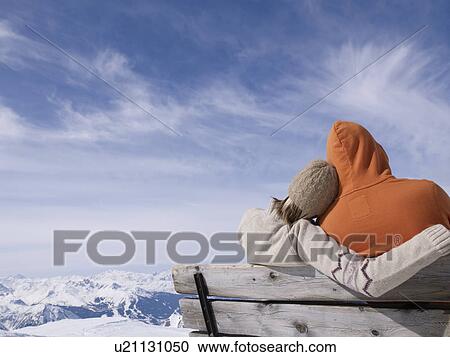 couple sitting on bench hugging View Large Photo Image Stock Image - couple sitting on bench hugging. Fotosearch