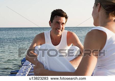 Couple Sitting On Pier View Large Photo Image Stock Image - Couple Sitting On Pier. Fotosearch