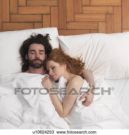 Couple sleeping in bed View Large Photo Image Stock Image - Couple sleeping in bed. Fotosearch