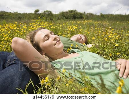 Couple Sleeping in Meadow View Large Photo Image Stock Photo - Couple Sleeping in Meadow. Fotosearch