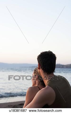 Stock Photo - Couple Watching Seaside. Fotosearch