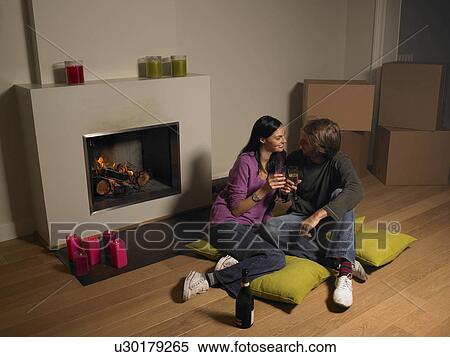 Couple with moving boxes, champagne View Large Photo Image Stock Photography - Couple with moving boxes, champagne. Fotosearch