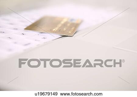Credit card on laptop computer keyboard View Large Photo Image Stock Photo - Credit card on laptop computer keyboard. Fotosearch