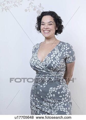 Curvy Woman standing up and smiling. View Large Photo Image Stock Photo - Curvy Woman standing up and smiling.. Fotosearch