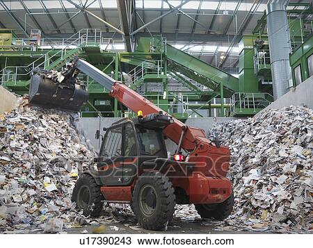 Stock Image - Digger Sorting Recycled Paper. Fotosearch