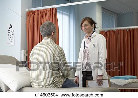 Doctor talking to patient View Large Photo Image Picture - Doctor talking to patient. Fotosearch