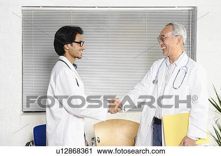 Stock Image - Doctors in waiting room. Fotosearch