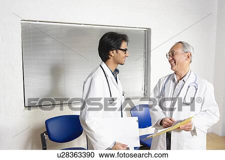 Stock Image - Doctors in waiting room. Fotosearch