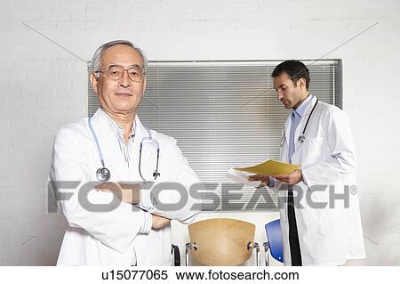 Stock Photography - Doctors in waiting room. Fotosearch
