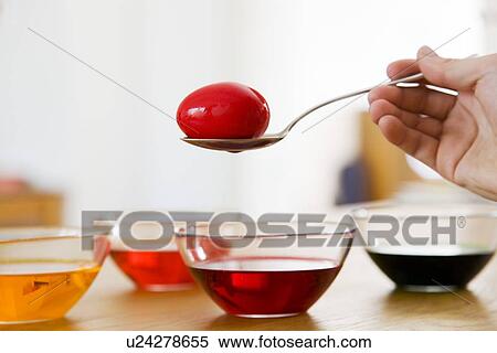 dyeing easter eggs View Large Photo Image Stock Photography - dyeing easter eggs. Fotosearch