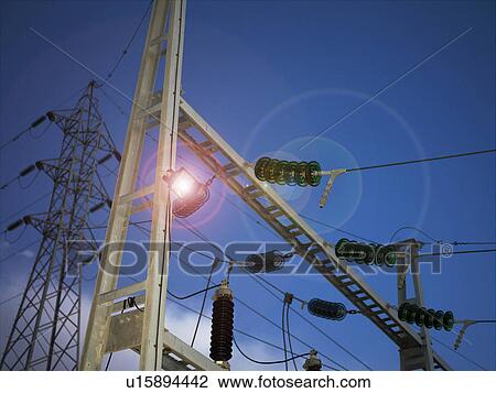 Stock Image - Electricity substation at night. Fotosearch