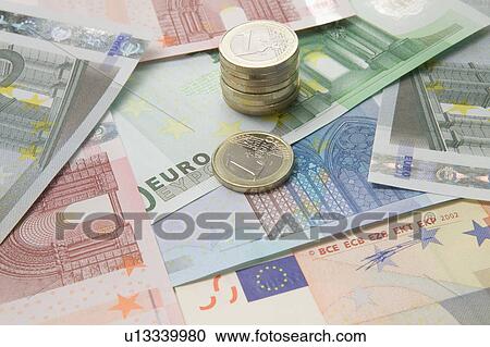 Euro currency and a stack of coins View Large Photo Image Stock Image - Euro currency and a stack of coins. Fotosearch
