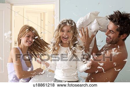 family having pillow fight View Large Photo Image Stock Photo - family having pillow fight. Fotosearch