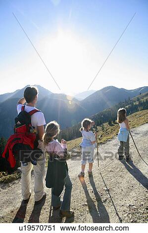 Stock Image - Family hiking on Mountain,. Fotosearch