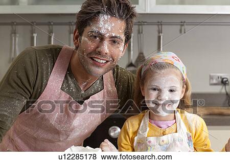 Stock Photo - father and daughter cooking. Fotosearch