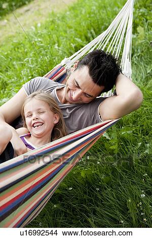 Father And Daughter In Hammock View Large Photo Image Picture - Father And Daughter In Hammock. Fotosearch