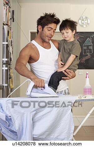 Stock Photo - father and son ironing. Fotosearch