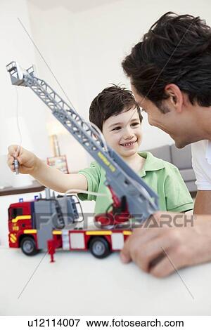 father and son playing View Large Photo Image Stock Photo - father and son playing. Fotosearch