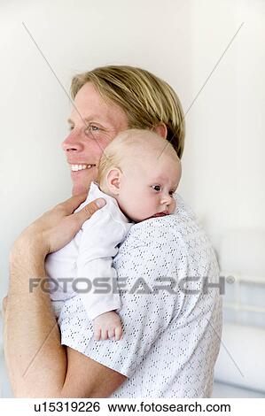 father carrying baby on shoulder View Large Photo Image Stock Photograph - father carrying baby on shoulder. Fotosearch