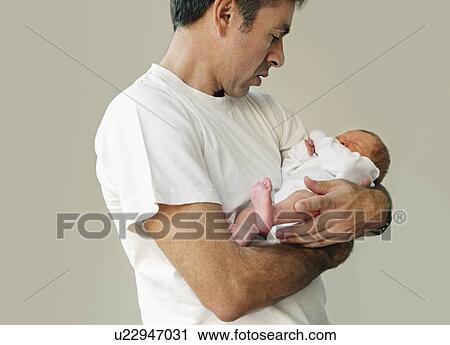 Father holding baby View Large Photo Image Stock Image - Father holding baby. Fotosearch