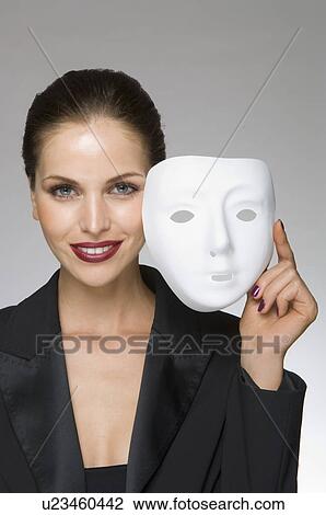 Stock Image - Female as business woman with mask. Fotosearch